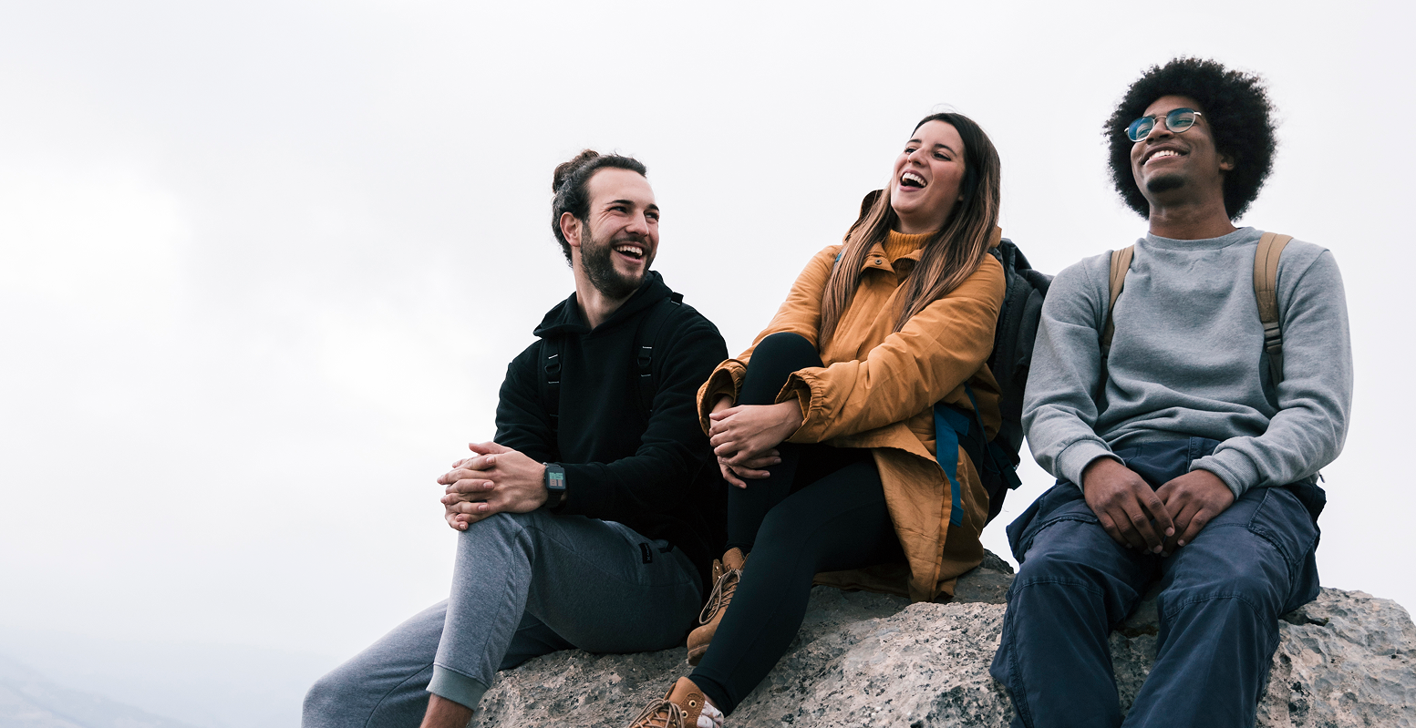 young-female-male-hiker-sitting-rock-enjoying 1-1